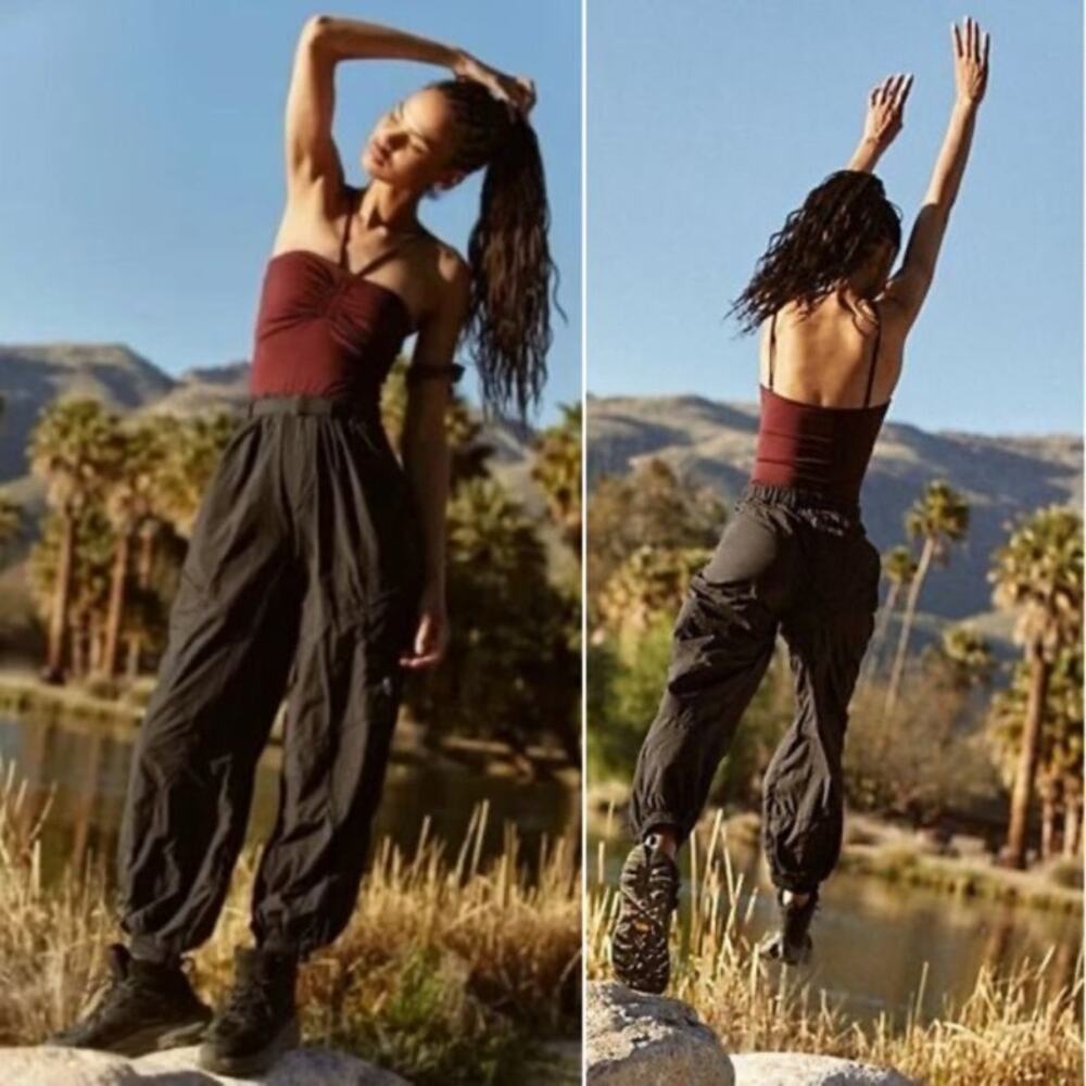 the FP Movement Rappel Tube Onesie in a burgundy and black colorway, 148$